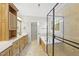 Primary bathroom boasts double sinks, a soaking tub, and a glass enclosed shower at 2721 Cameron Pond Dr, Cary, NC 27519