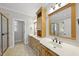 Primary bathroom boasts double sinks, a soaking tub, and a glass enclosed shower at 2721 Cameron Pond Dr, Cary, NC 27519