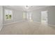 Bright bedroom with plush carpet, neutral walls, plantation shutters, and walk-in closet at 2721 Cameron Pond Dr, Cary, NC 27519