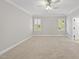 Bright bedroom with plush carpet, neutral walls, plantation shutters, and walk-in closet at 2721 Cameron Pond Dr, Cary, NC 27519