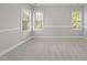 Bright bedroom with plush carpet, neutral walls, plantation shutters, and ample light at 2721 Cameron Pond Dr, Cary, NC 27519