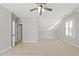 Large bonus room featuring neutral carpeting, white trim, and natural light at 2721 Cameron Pond Dr, Cary, NC 27519