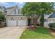 Inviting exterior with a charming entrance and a beautifully landscaped front yard at 2721 Cameron Pond Dr, Cary, NC 27519