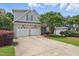 Lovely two-story home featuring a spacious driveway and well-maintained landscaping at 2721 Cameron Pond Dr, Cary, NC 27519