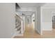Inviting foyer showcasing beautiful hardwood floors and elegant staircase at 2721 Cameron Pond Dr, Cary, NC 27519