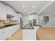 Bright open kitchen with granite countertops, stainless steel appliances, and an island at 2721 Cameron Pond Dr, Cary, NC 27519
