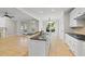Bright open kitchen with granite countertops, stainless steel appliances, and an island at 2721 Cameron Pond Dr, Cary, NC 27519