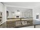 Kitchen area with sink, counter tops, and a view of the living room and fireplace at 2721 Cameron Pond Dr, Cary, NC 27519