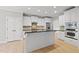 Bright open kitchen with granite countertops, stainless steel appliances, and an island at 2721 Cameron Pond Dr, Cary, NC 27519