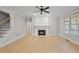 Spacious living room boasts a fireplace, natural light, and hardwood floors at 2721 Cameron Pond Dr, Cary, NC 27519