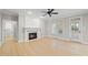 Spacious living room with a fireplace, hardwood floors, and plenty of natural light at 2721 Cameron Pond Dr, Cary, NC 27519