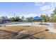 Outdoor community pool surrounded by a metal fence, concrete deck, and shaded canopy areas at 2721 Cameron Pond Dr, Cary, NC 27519