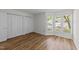 Bright bedroom with laminate flooring, a large closet, and a sunny bay window at 2821 Edridge Ct, Raleigh, NC 27612