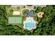 Overhead shot of a community center featuring a swimming pool, clubhouse, tennis court and playground at 303 Middleham Dr, Rolesville, NC 27571