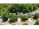 Aerial view of a charming neighborhood with tree-lined streets and well-maintained homes at 303 Middleham Dr, Rolesville, NC 27571