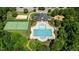 Overhead shot of a community center featuring a swimming pool, clubhouse, tennis court and playground at 303 Middleham Dr, Rolesville, NC 27571