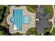 Overhead view of pool area surrounded by lounge chairs, tables and the community center at 303 Middleham Dr, Rolesville, NC 27571