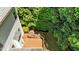 Aerial view of spacious wood deck and beautiful landscaped backyard with a stone fire pit at 303 Middleham Dr, Rolesville, NC 27571