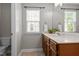 Bathroom features a single vanity, decorative plants and plenty of light at 303 Middleham Dr, Rolesville, NC 27571