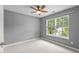 Cozy bedroom with natural light and a ceiling fan at 303 Middleham Dr, Rolesville, NC 27571