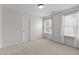 Bedroom with neutral carpet, a large window, and ample natural light and neutral paint at 303 Middleham Dr, Rolesville, NC 27571