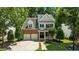 Beautiful two-story home featuring brick, siding, a two-car garage, and a well-kept lawn at 303 Middleham Dr, Rolesville, NC 27571