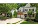 Charming two-story brick and siding home with a two-car garage and basketball hoop at 303 Middleham Dr, Rolesville, NC 27571