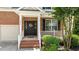 Inviting front entrance with brick steps, black door, and decorative wreath at 303 Middleham Dr, Rolesville, NC 27571