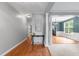 Hallway view of dining and living rooms with hardwood floors and white columns at 303 Middleham Dr, Rolesville, NC 27571