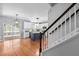 Modern kitchen with hardwood floors, island, and stainless steel appliances at 303 Middleham Dr, Rolesville, NC 27571