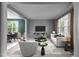 Open living room with neutral colors and large windows at 303 Middleham Dr, Rolesville, NC 27571
