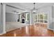 Open-concept living space featuring fireplace, dining area, and access to the porch at 303 Middleham Dr, Rolesville, NC 27571