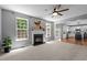 Bright living room showcasing the fireplace and adjacent kitchen at 303 Middleham Dr, Rolesville, NC 27571