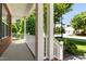 Covered porch showcasing white railing and a view of the front yard at 303 Middleham Dr, Rolesville, NC 27571