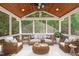 Cozy screened-in porch with comfortable seating and wood ceiling at 303 Middleham Dr, Rolesville, NC 27571