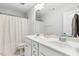 Well-lit bathroom featuring a double sink vanity and shower/tub combo at 307 W Copenhaver Dr, Clayton, NC 27527