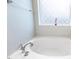 Close up of a bathtub with decorative window at 307 W Copenhaver Dr, Clayton, NC 27527