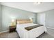 Bedroom with a well-lit bed, side tables, and a relaxing ambiance at 307 W Copenhaver Dr, Clayton, NC 27527