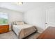 Neutral toned bedroom with wood dresser and a carpeted floor at 307 W Copenhaver Dr, Clayton, NC 27527