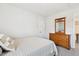 Bedroom with carpet, a bed, and a wooden dresser with mirror at 307 W Copenhaver Dr, Clayton, NC 27527