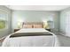 Bedroom featuring a plush bed with soft lighting and neutral decor at 307 W Copenhaver Dr, Clayton, NC 27527