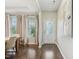 Elegant dining room with natural light, modern decor, and hardwood flooring, perfect for entertaining guests at 307 W Copenhaver Dr, Clayton, NC 27527