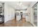 Modern kitchen with stainless steel appliances, white cabinetry, and granite countertops at 307 W Copenhaver Dr, Clayton, NC 27527