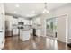 Stylish kitchen with stainless appliances, center island, and sliding door to a screened in patio at 307 W Copenhaver Dr, Clayton, NC 27527