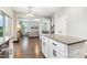 Kitchen with view of the living room has an island, granite counters and stainless steel appliances at 307 W Copenhaver Dr, Clayton, NC 27527