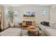 Well-lit living room showcasing stylish furniture and a large flat screen TV at 307 W Copenhaver Dr, Clayton, NC 27527
