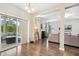 Open living area with modern decor and seamless access to outdoor patio seating through sliding glass doors at 307 W Copenhaver Dr, Clayton, NC 27527