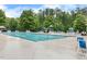 Community pool with a playground and plentiful seating at 307 W Copenhaver Dr, Clayton, NC 27527