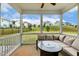 Screened in porch with outdoor sectional and great views at 307 W Copenhaver Dr, Clayton, NC 27527