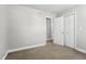 Bedroom with neutral carpeting, a standard closet, and soft gray walls at 308 Sandy Knob Ln, Rocky Mount, NC 27803